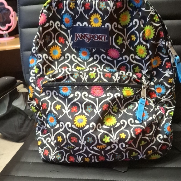 Jansport Black Backpack with Colorful Floral Pattern - Picture 1 of 2